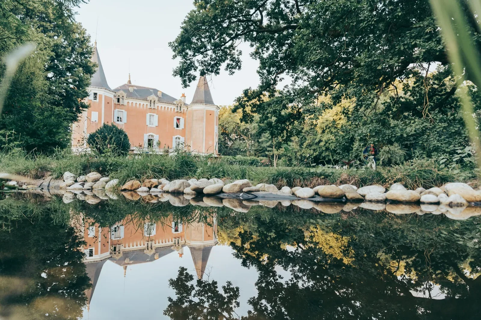 Château de Garrevaques reflected in the water of the park